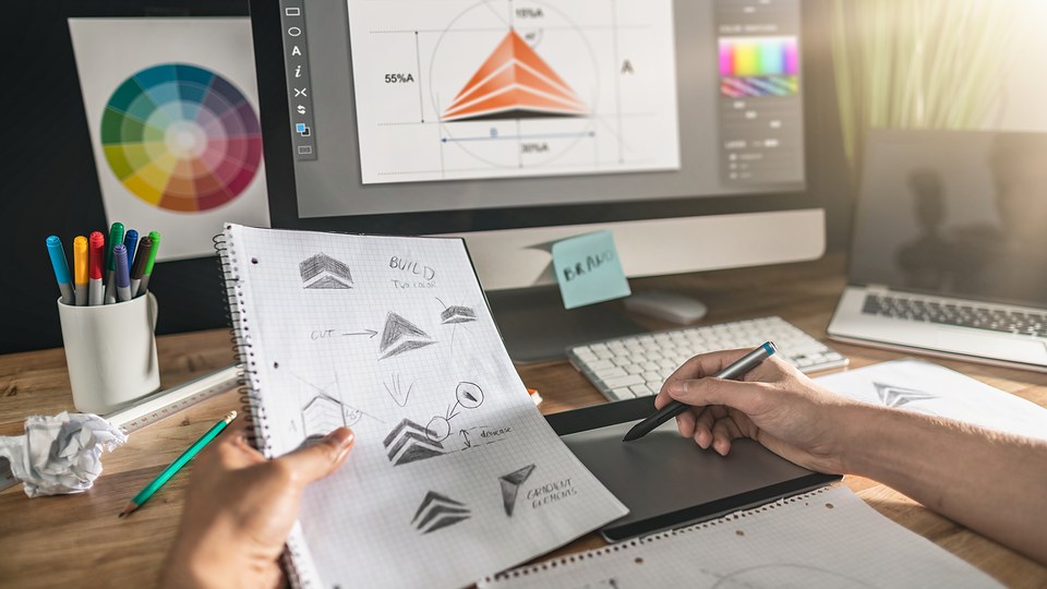 A designer at work — concepts, revisions and final files crafted with care for each engagement